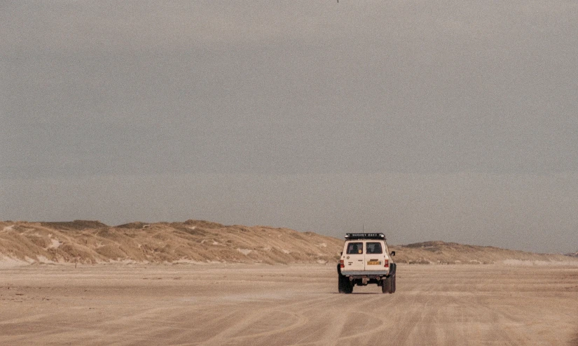 a truck driving through an open field