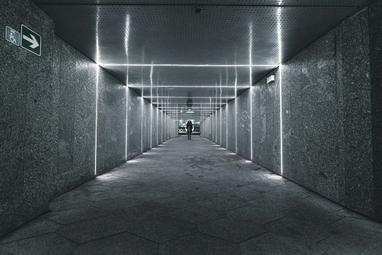 a long walkway in the middle of a building