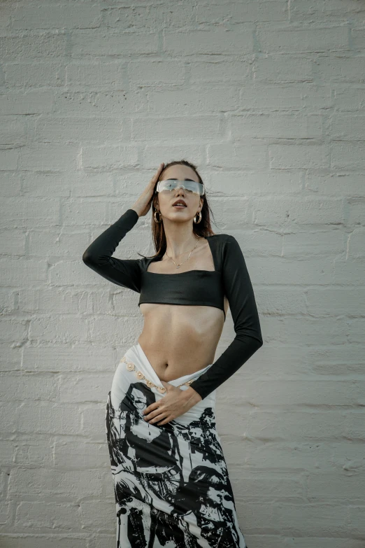 a woman in a bikini is posing for the camera