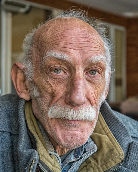 an older man with a gray moustache