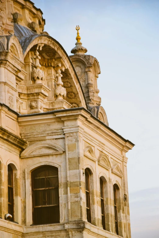 a church that is stone and has windows on the side