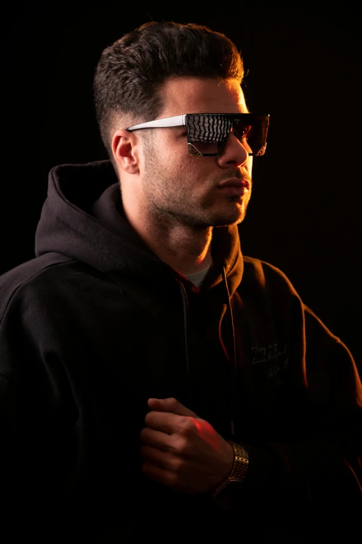 a man wearing sunglasses with the reflection of his eye