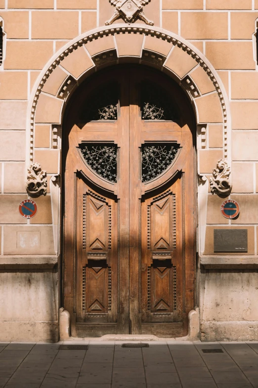 a brown door sits on a brick building