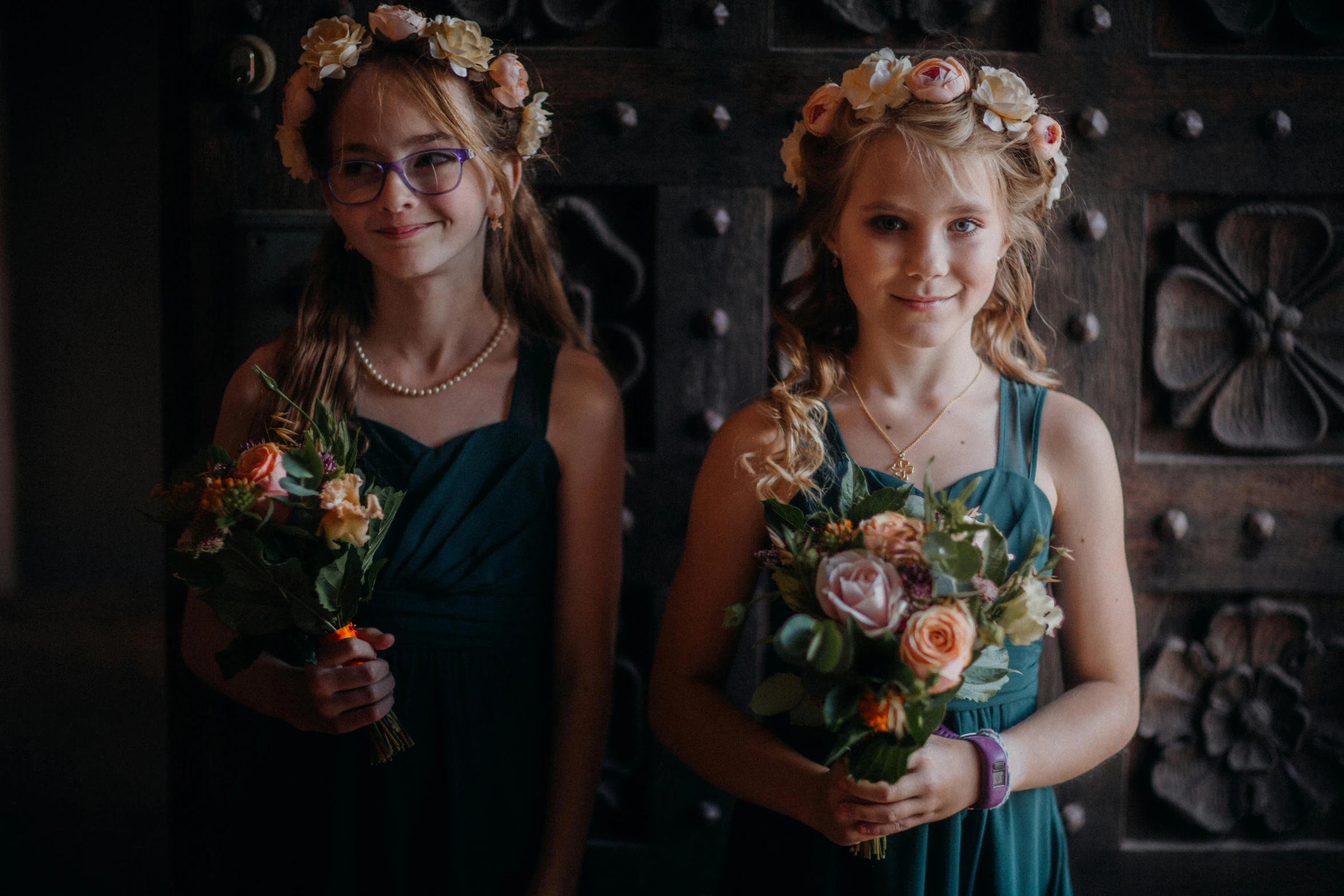 two girls posing with flower crowns for po