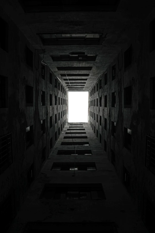 an empty hallway that appears to be built in cement blocks