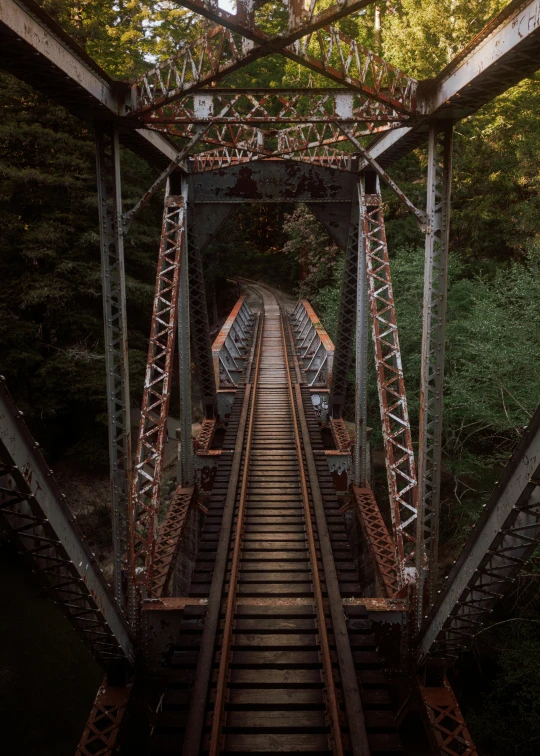 a train is going over the top of the bridge