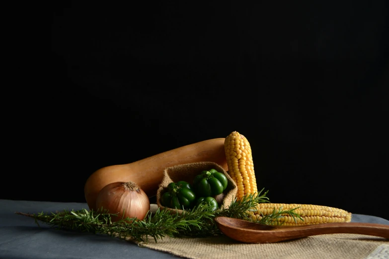 an image of a corn and sausage still on the table
