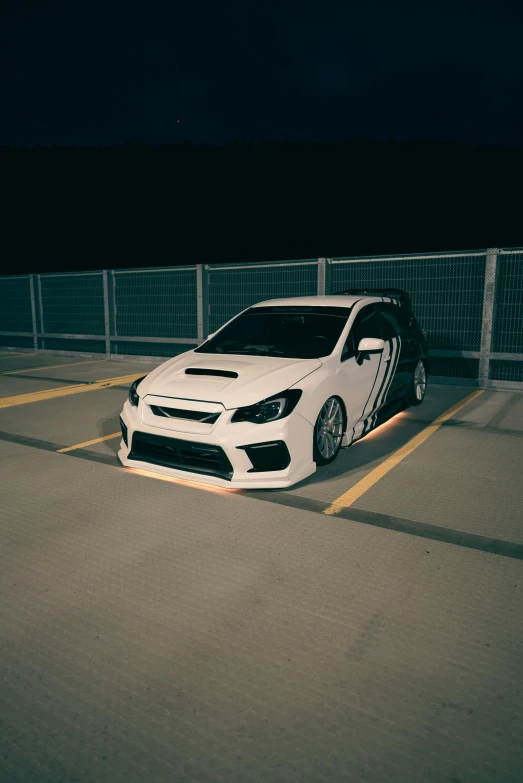 a white car parked in a parking lot