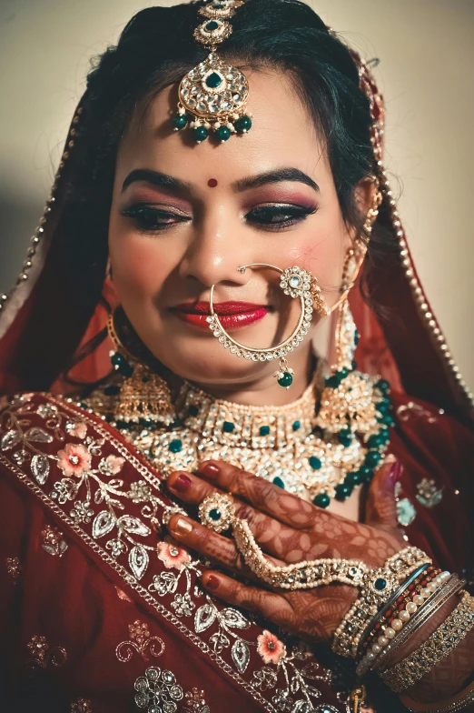 a woman with some makeup and jewelry on