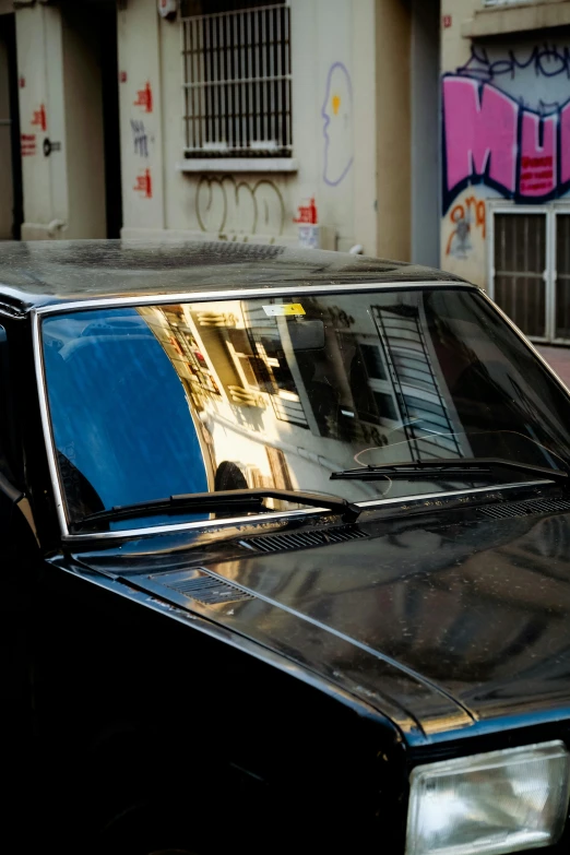 an image of a parked car near some buildings