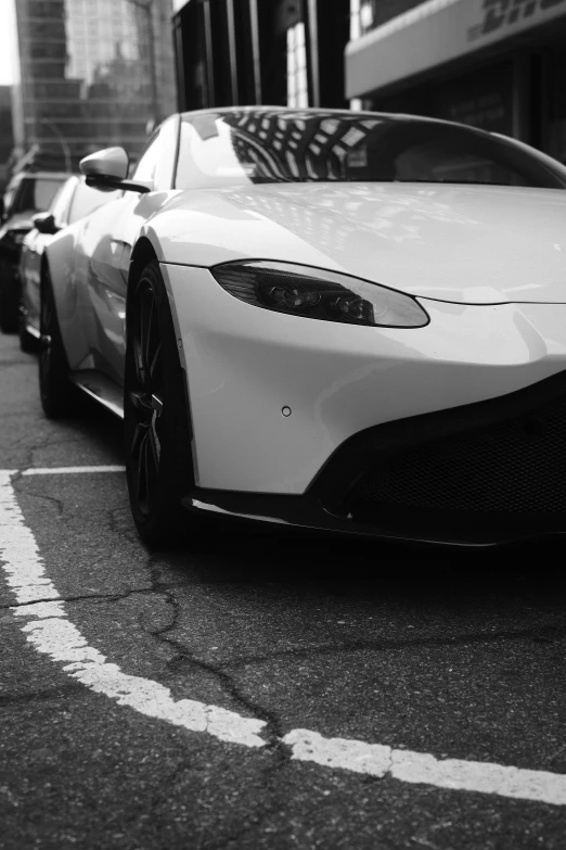 a white supercars sits in the middle of the street