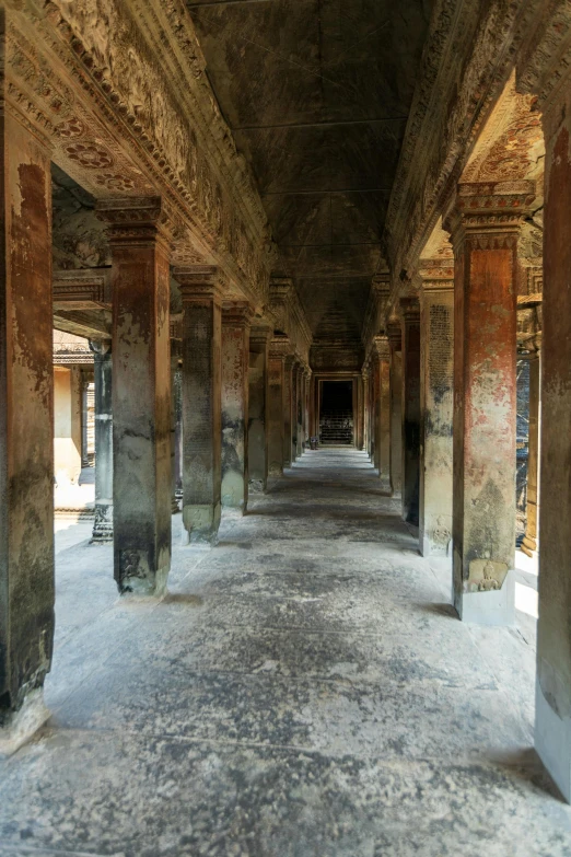 an ancient building with several pillars and pillars