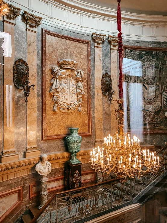 ornately decorated staircase in a building with glass balconies