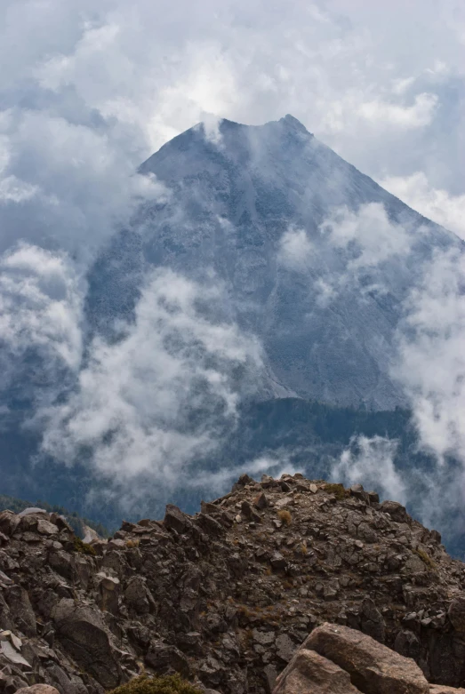 view from the top of the mountain with low clouds