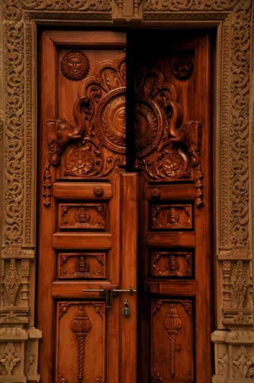 a large wooden door is opened in a stone building