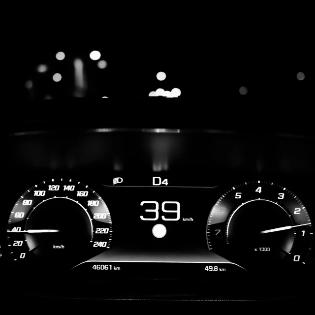 a closeup of a meter on the dashboard