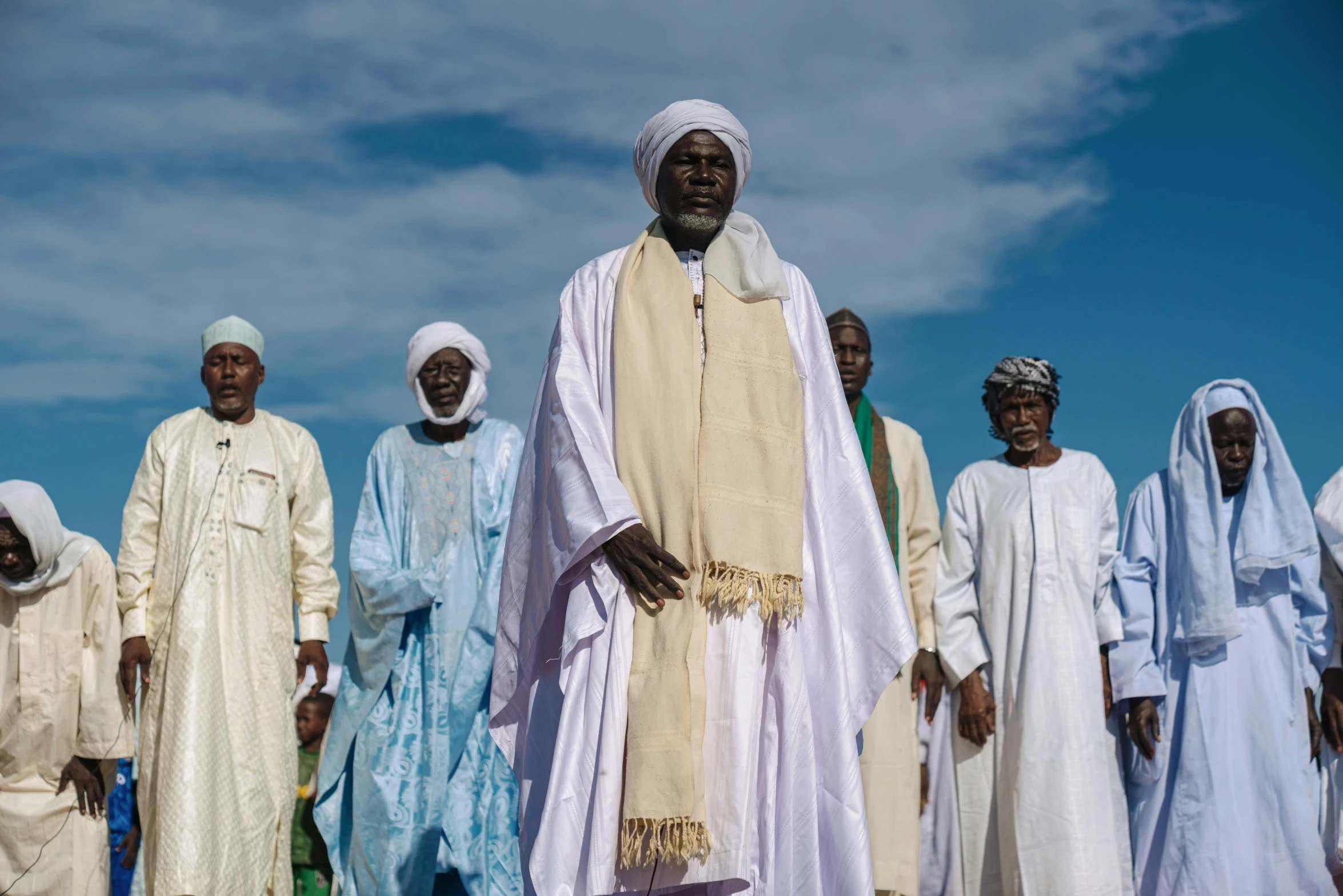 an african man is wearing a traditional white clothing