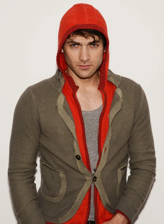 a man with red hoodie and a grey sweater