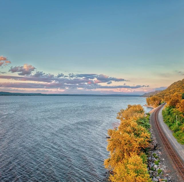 a view of a road that leads down to the ocean