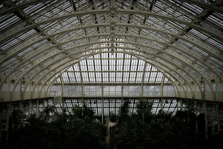 the large atrium has multiple windows and a clock