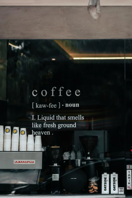 a window display in a store with the words coffee on it