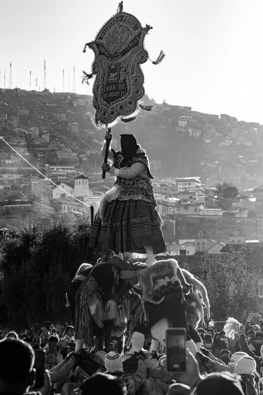 a large costumed lady walking down the street