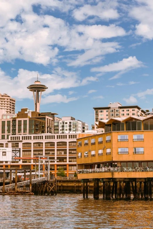 a view of some city buildings with a water view