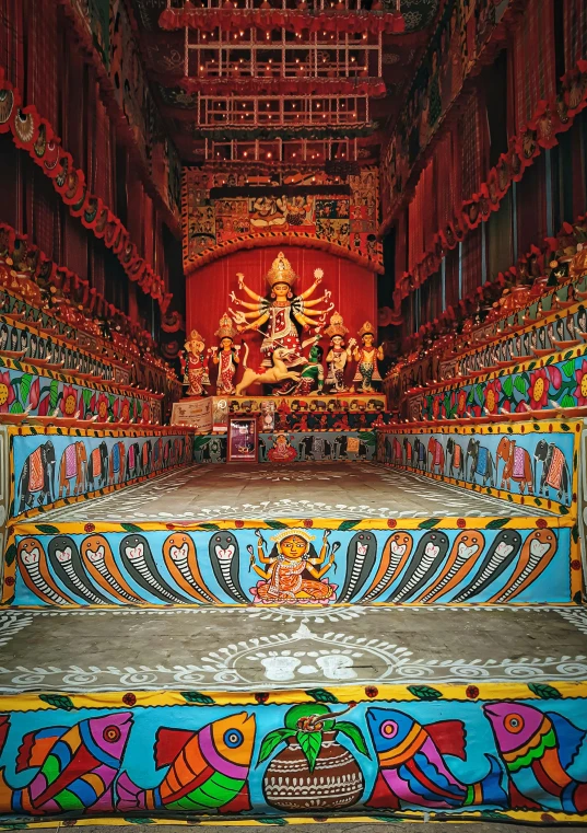 an elaborately painted area with decorative decorations and a statue