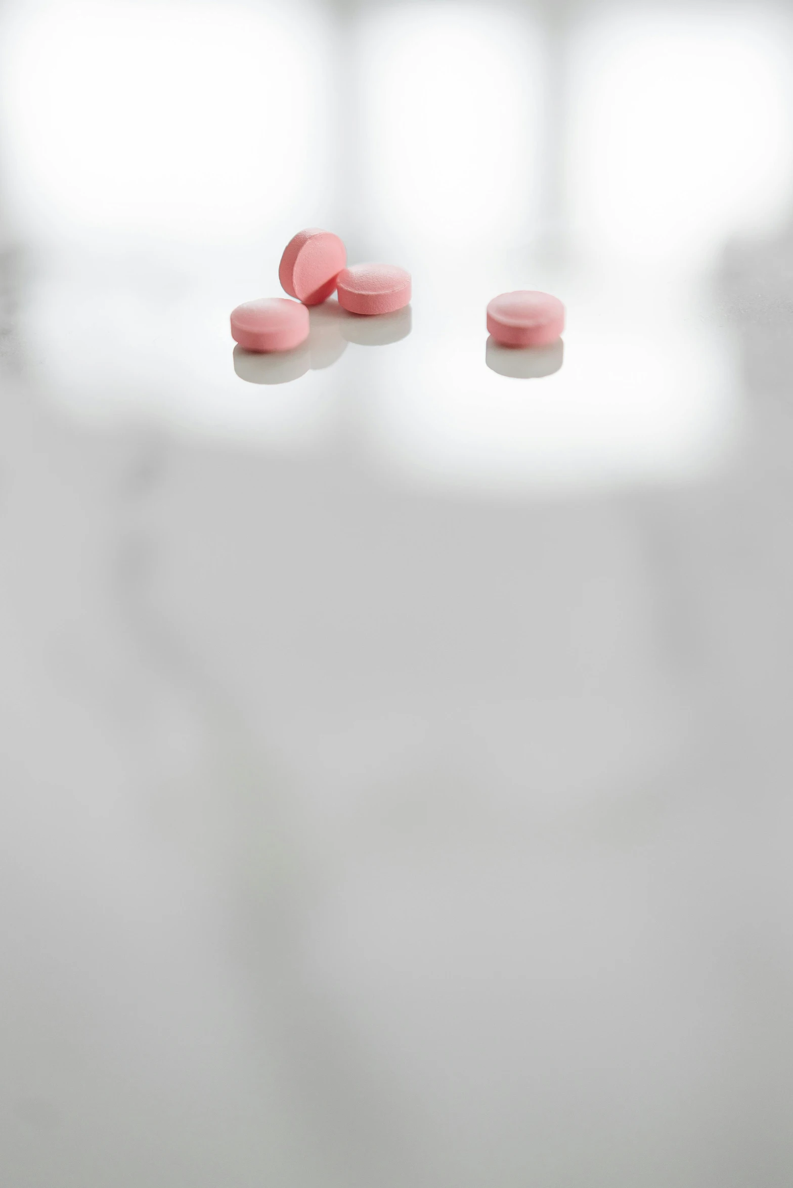 two pills sitting on a table next to each other