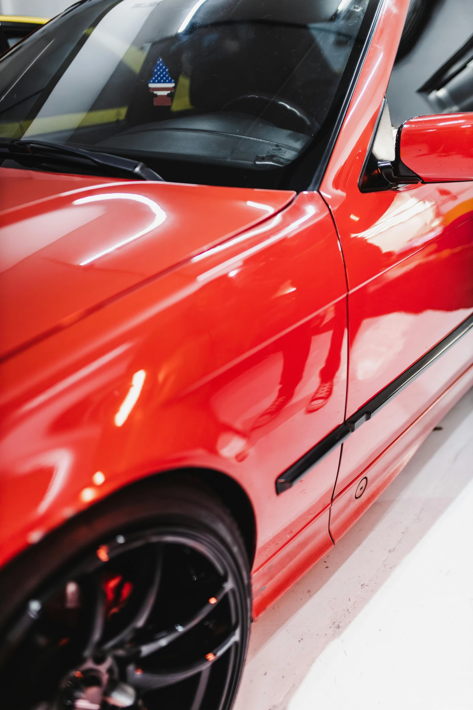 the front door of a red car with no interior doors