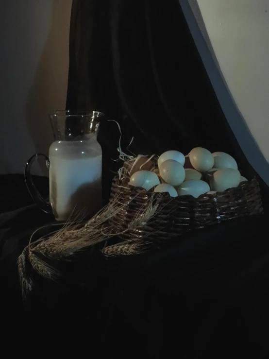 a bowl filled with eggs and milk on a table