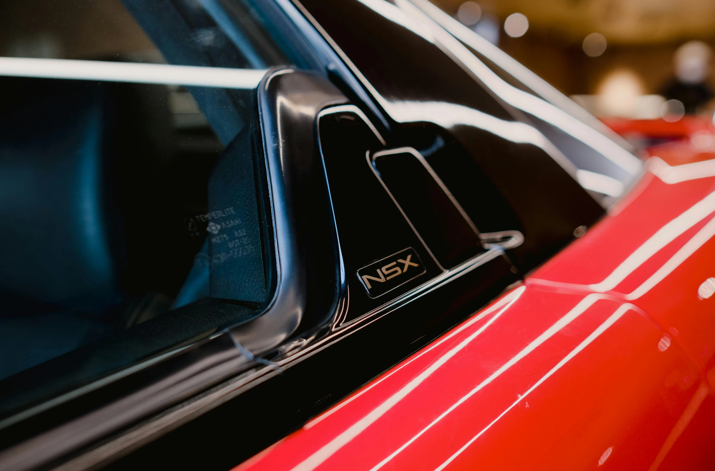 the side view mirror of a car parked in a garage