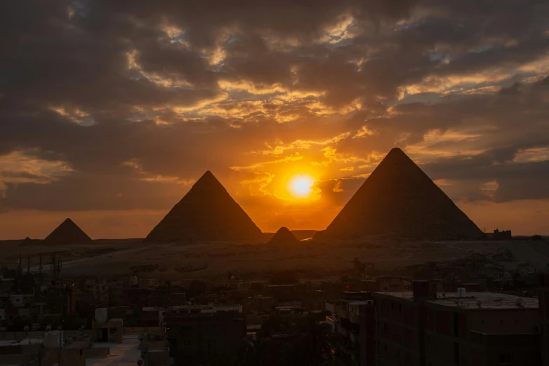 a group of pyramids sitting in the middle of a desert