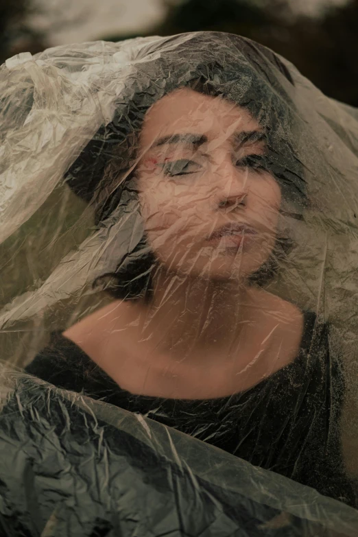 the face of a woman covered with plastic