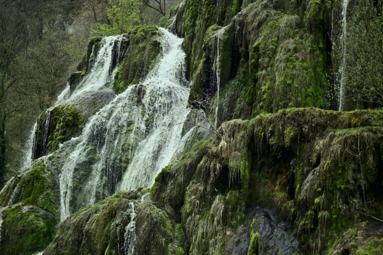 the water running down this rocky waterfall