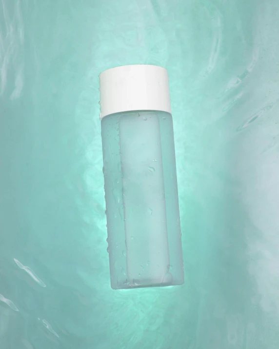 the bottle is floating in the water by itself