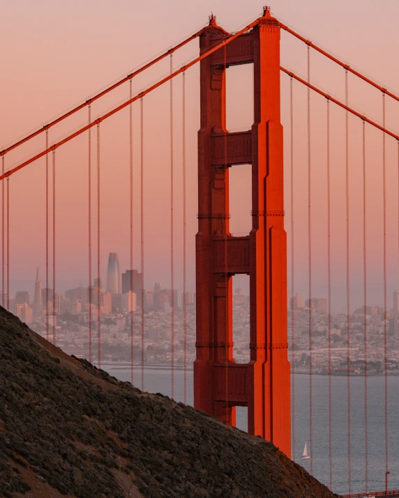 the golden gate bridge at sunset overlooking san francisco