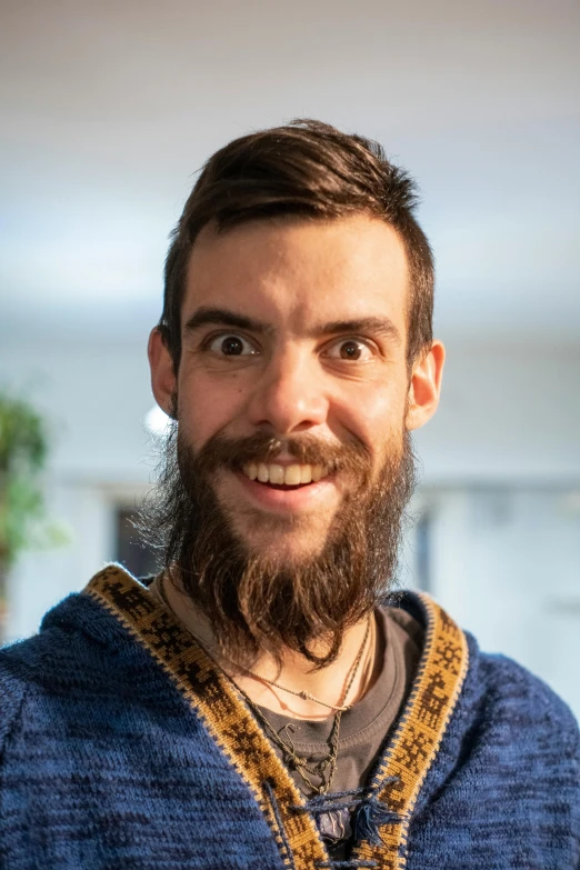 a bearded man with a beard is looking upward