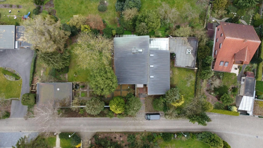 a view from above of houses in a wooded area