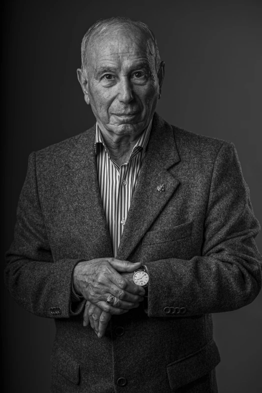 black and white pograph of an older man wearing a suit