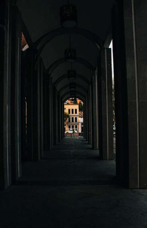 the dark corridor has lots of windows on each side