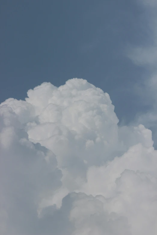 clouds with very large amounts of white and grey