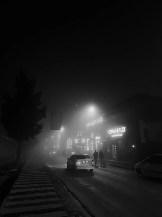 a car parked on the street at night