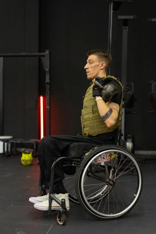 a man in a wheelchair wearing safety gear