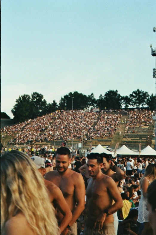 two men standing next to each other in front of an audience