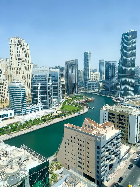 an aerial view of some large buildings next to a river