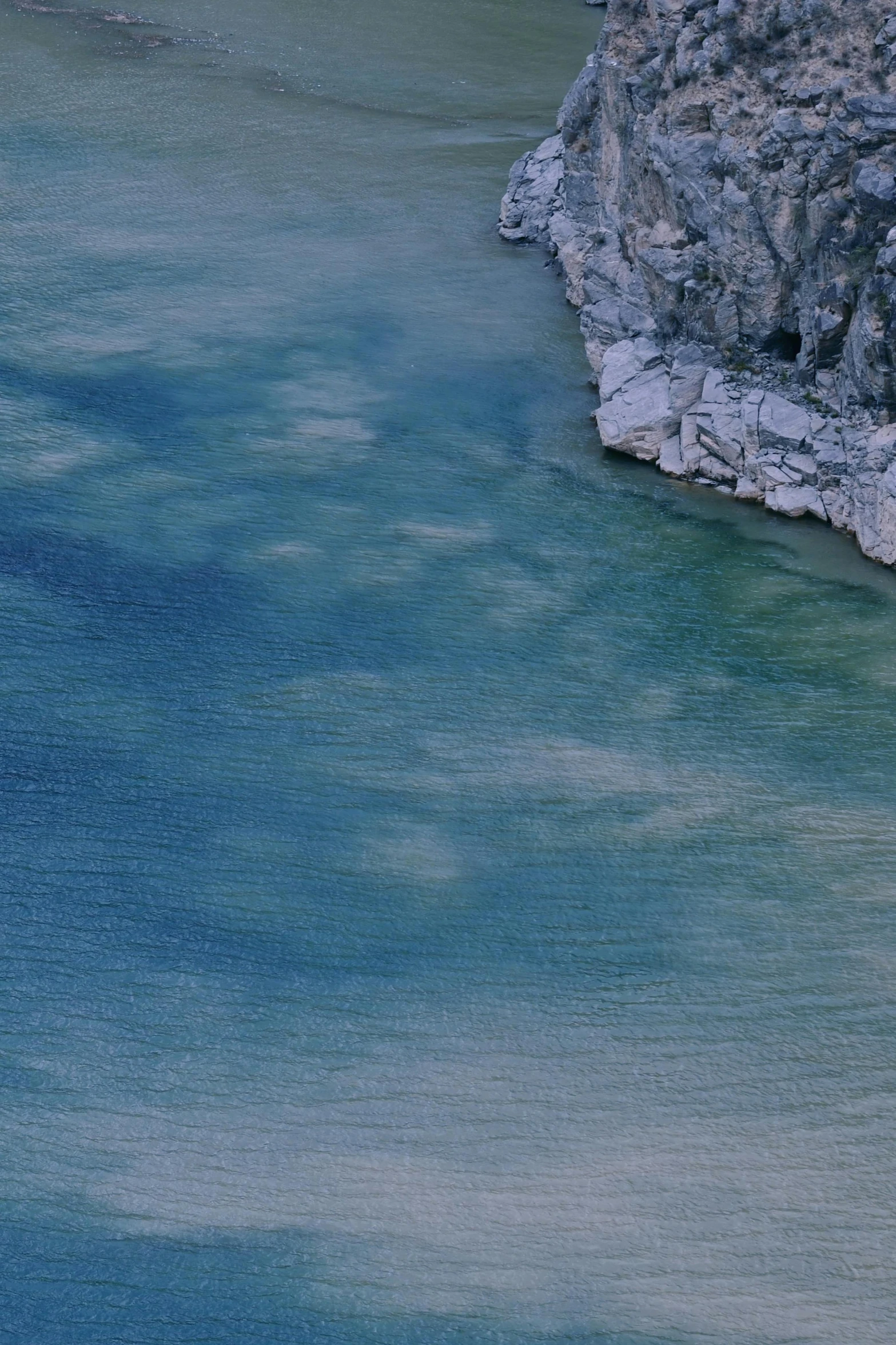 a po from the air of an elephant that is in the water