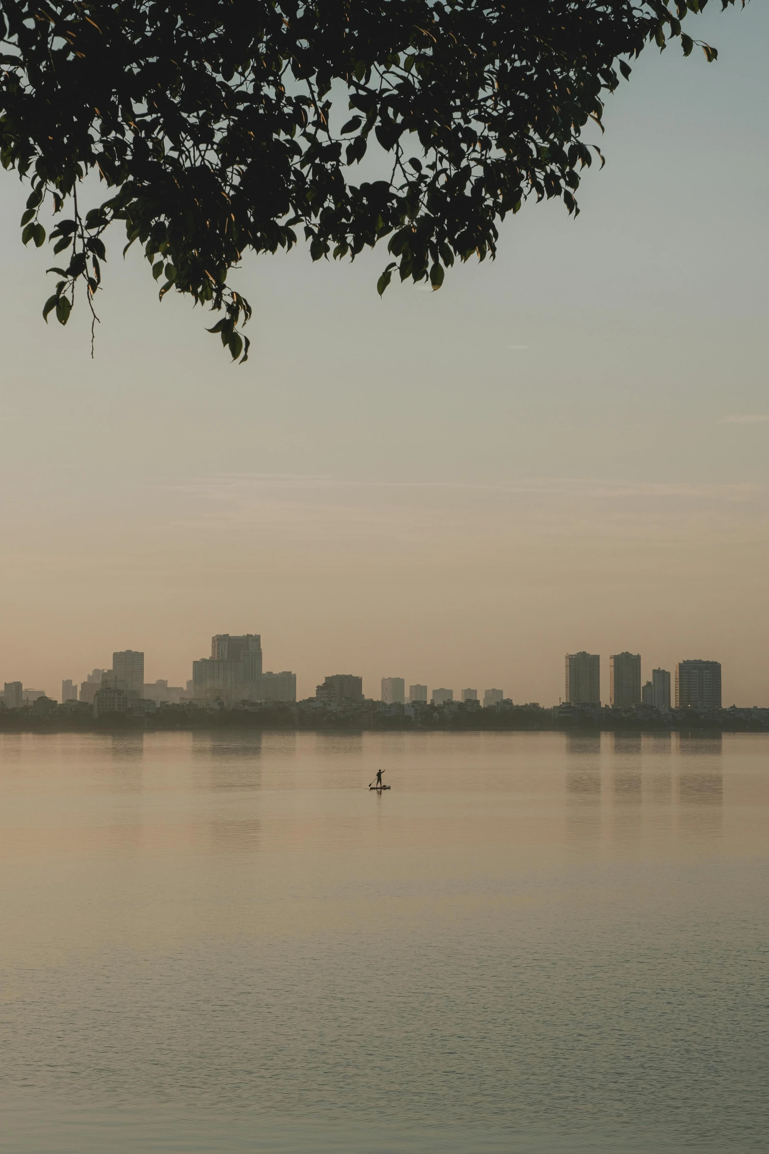 a person in a small boat on the water