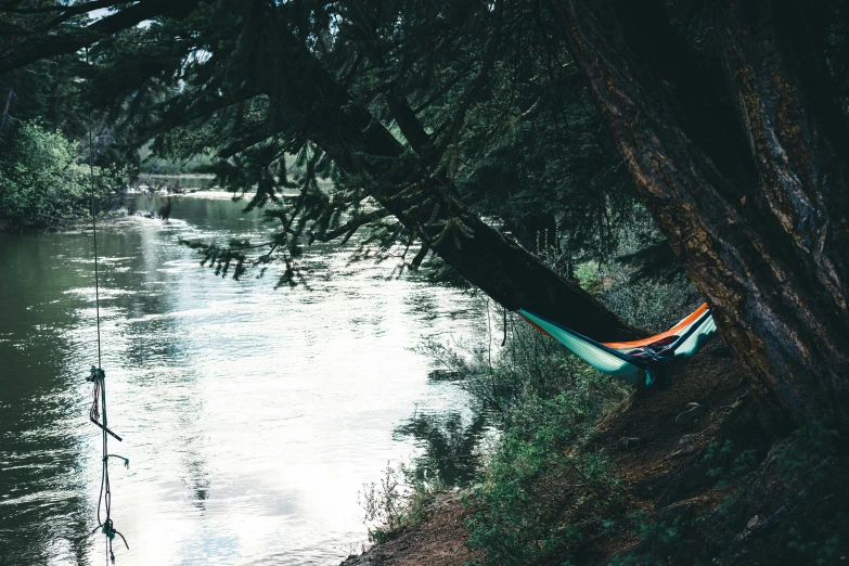 a hammock sitting on top of a lake