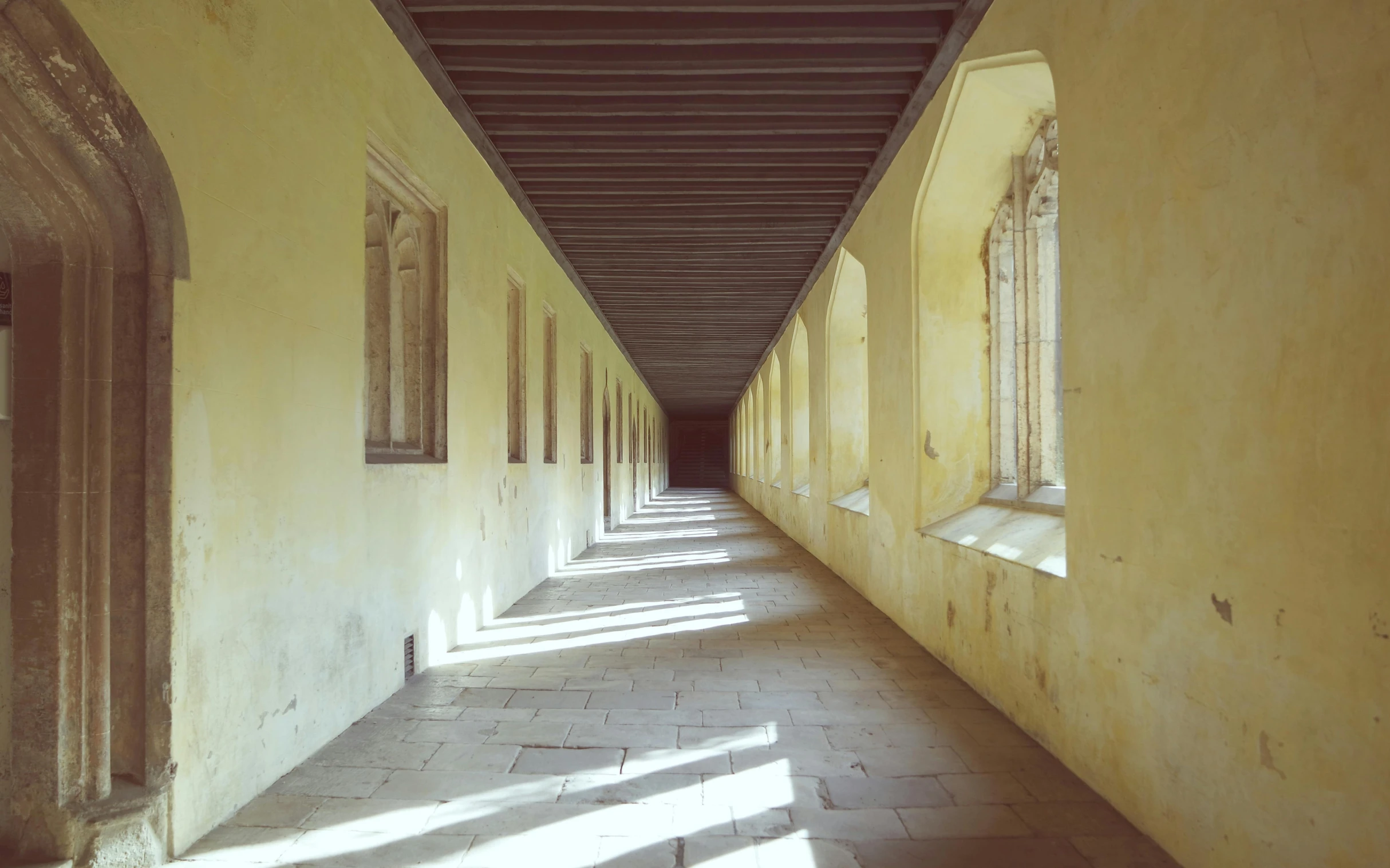 the light shines in between two buildings